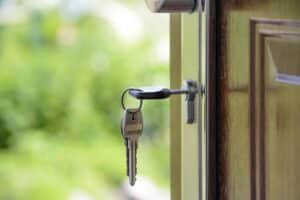 keys in the door of a house that has been sold fast